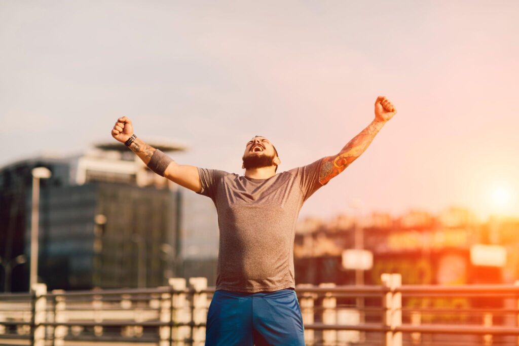 A man shouting happily after experiencing success.