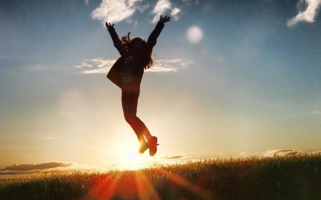 A shadow of a woman jumping after experiencing success in life.